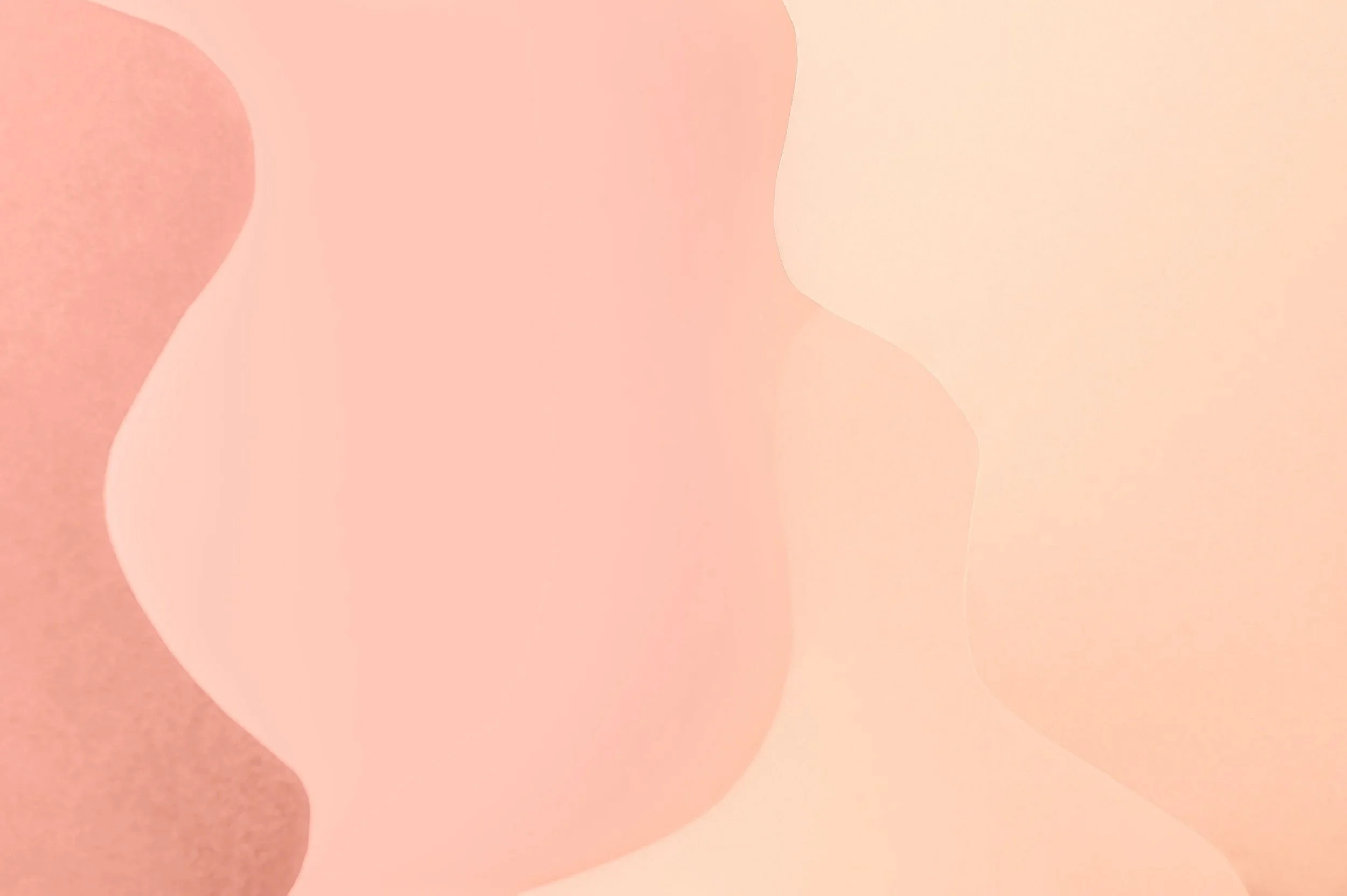 Abstract pastel-colored shapes with smooth, rounded edges in shades of pink, peach, and beige.