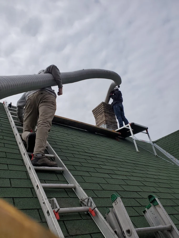 A new stainless steel liner going up a chimney on one of our jobs