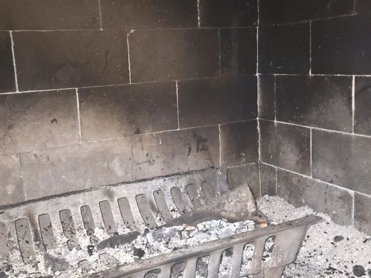 A wood-burning firebox on one of our jobs. We photograph everything we find.