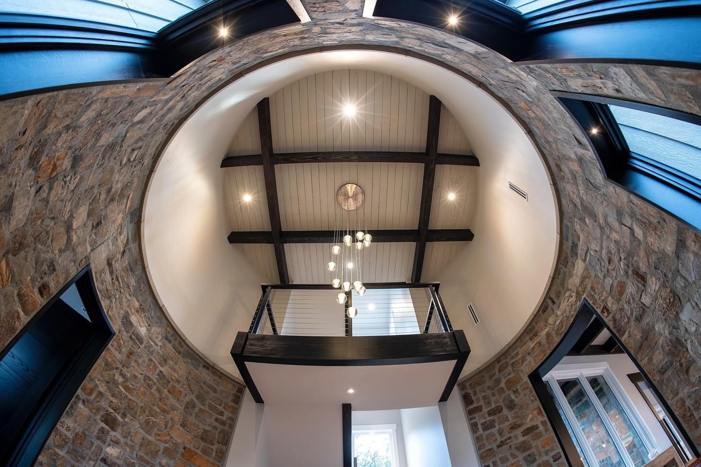 The silo in this house is truly a standout feature, serving both functional and aesthetic purposes. 

Inside, the silo plays a fundamental role in connecting the primary bedroom wing to the main living room.
 
The upper portion of the silo houses a c