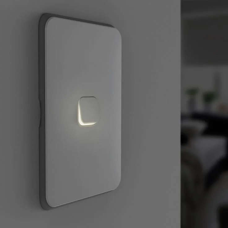 Close-up of a modern, sleek wall-mounted smart light switch with an illuminated touch button, in a minimalist design.