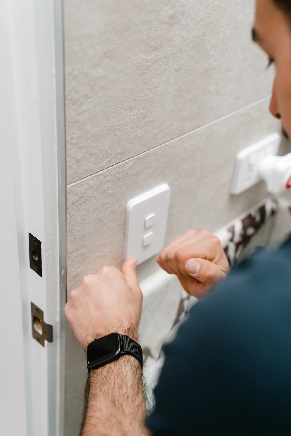 Lighting keypad being installed on a feature wall