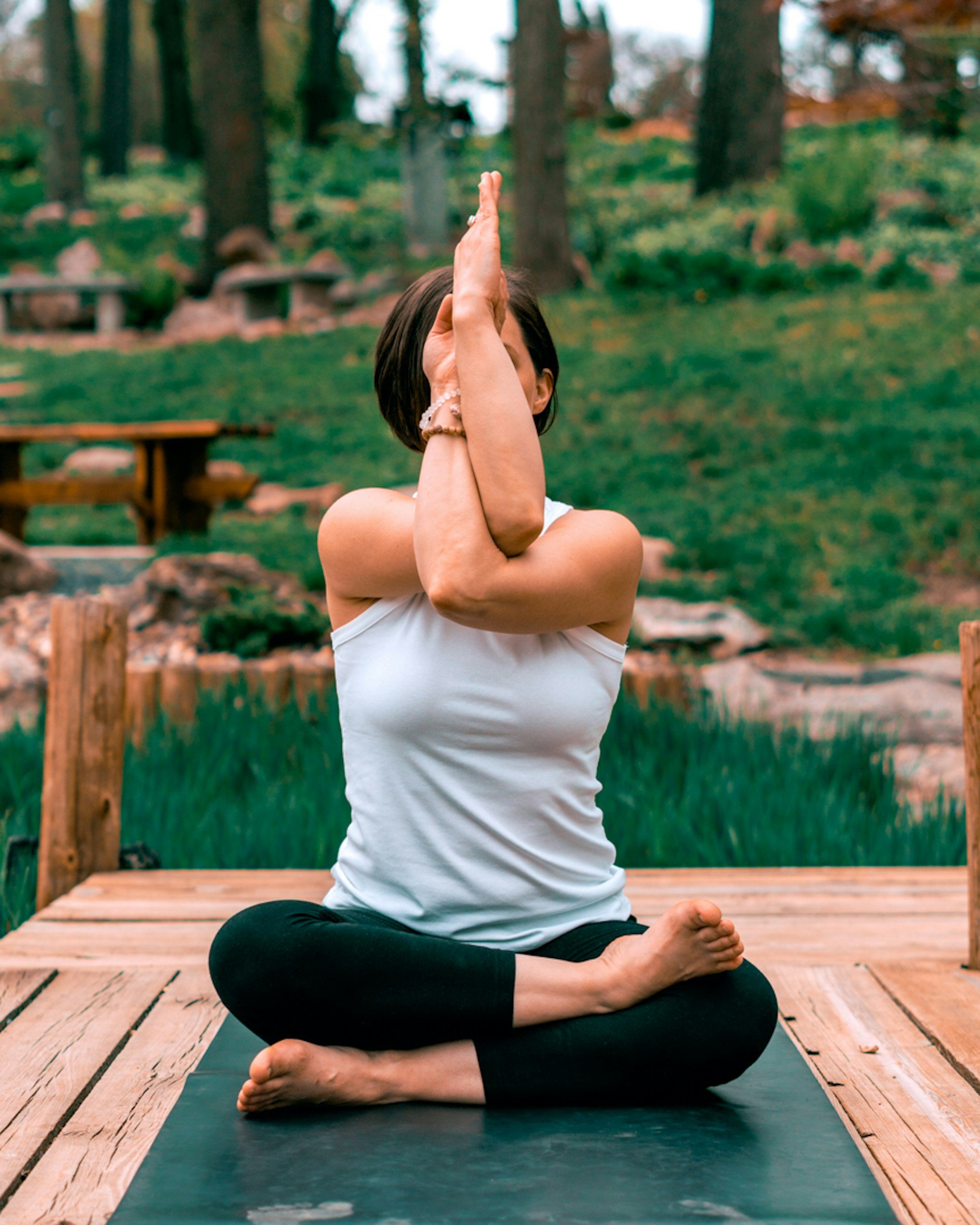 Woman in yoga pose in nature