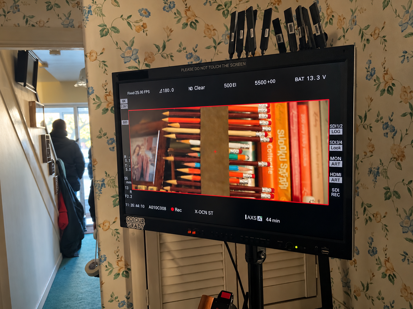 Subtle cinematic warmth around a film monitor.png