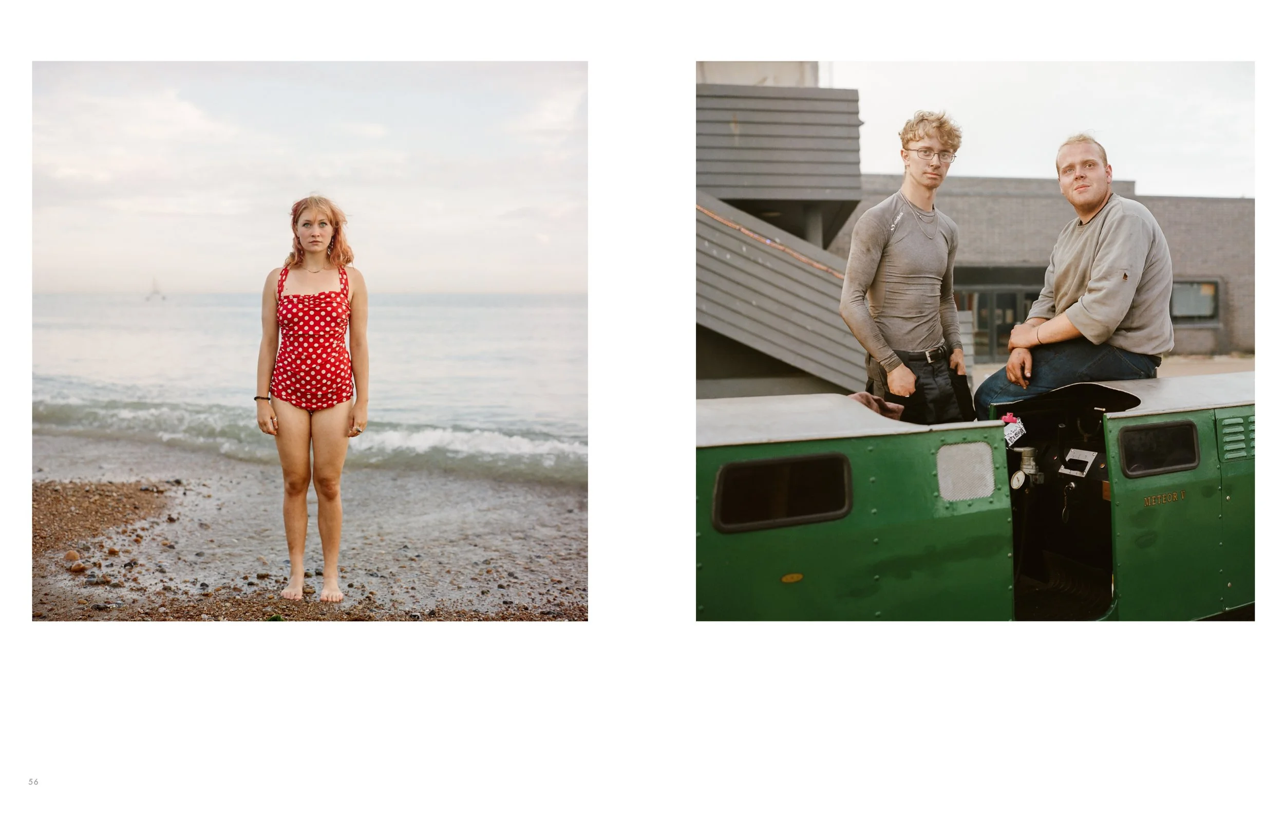 A young woman in a red polka dot swimsuit standing on a beach with waves and a cloudy sky behind her, and two young men sitting on a green generator or machinery with a building and an outdoor setting in the background.