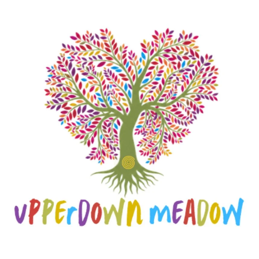 Colorful tree with rainbow-colored leaves and roots, with the words "UPPER DOWN MEADOW" in multicolored letters below.
