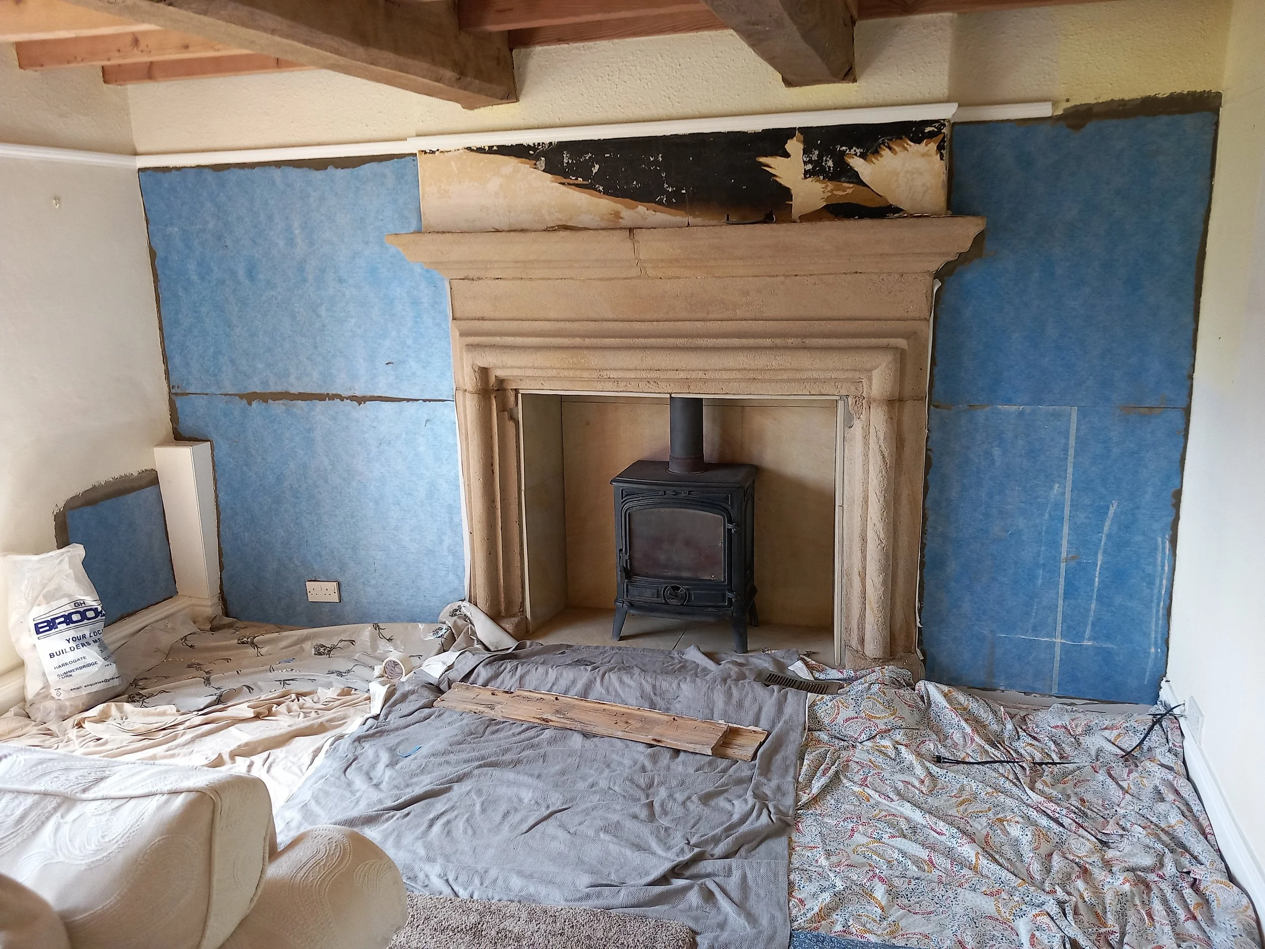 Living room damp proof treatment with flex membrane on chimney breast wall