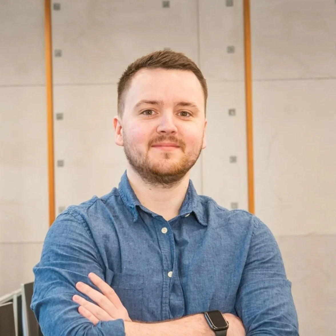 A photograph of Ollie Potten inside the Synergy Forward office.