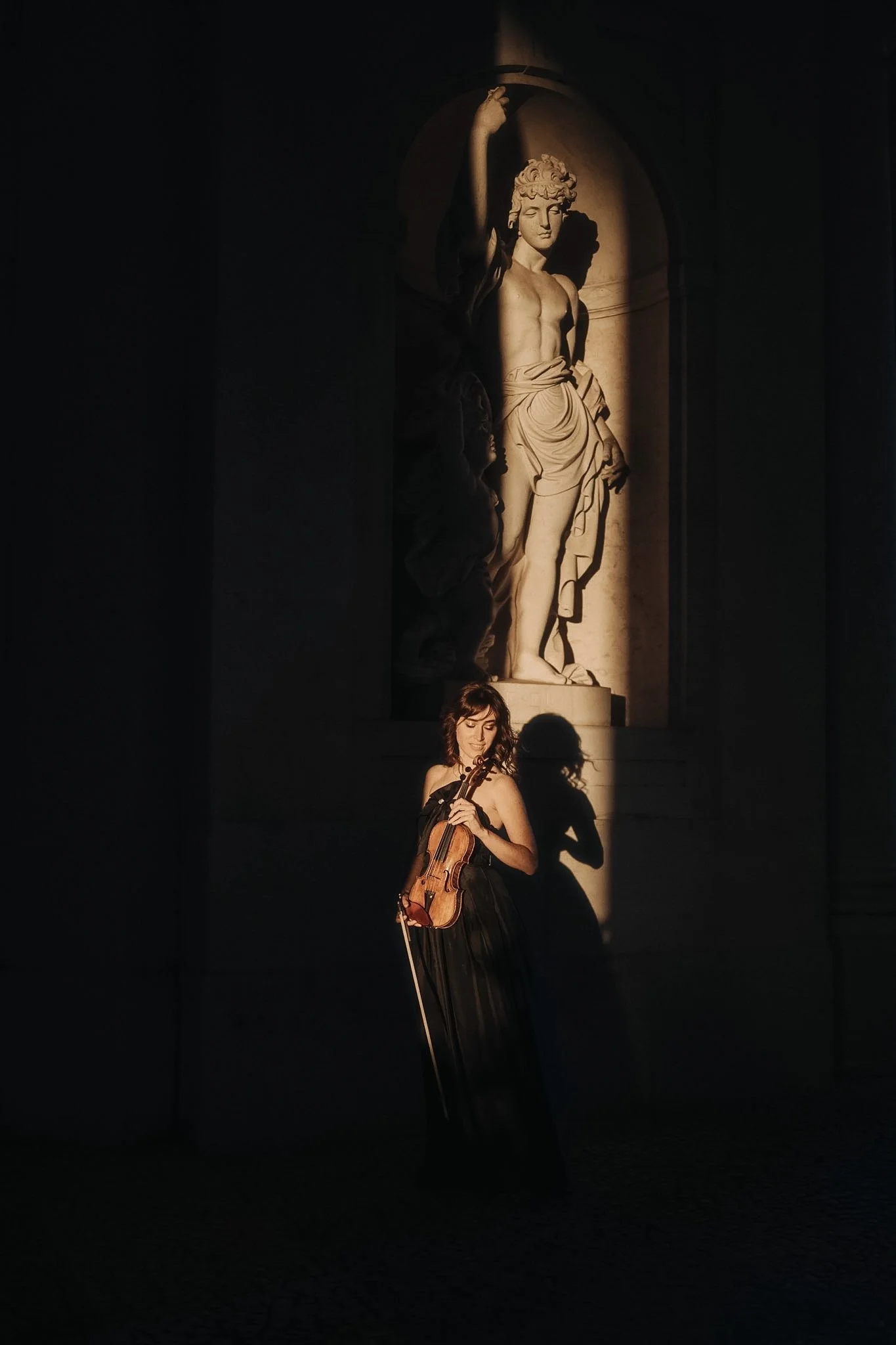 Cinematic portrait of a violonist woman in Lisbon at golden hour