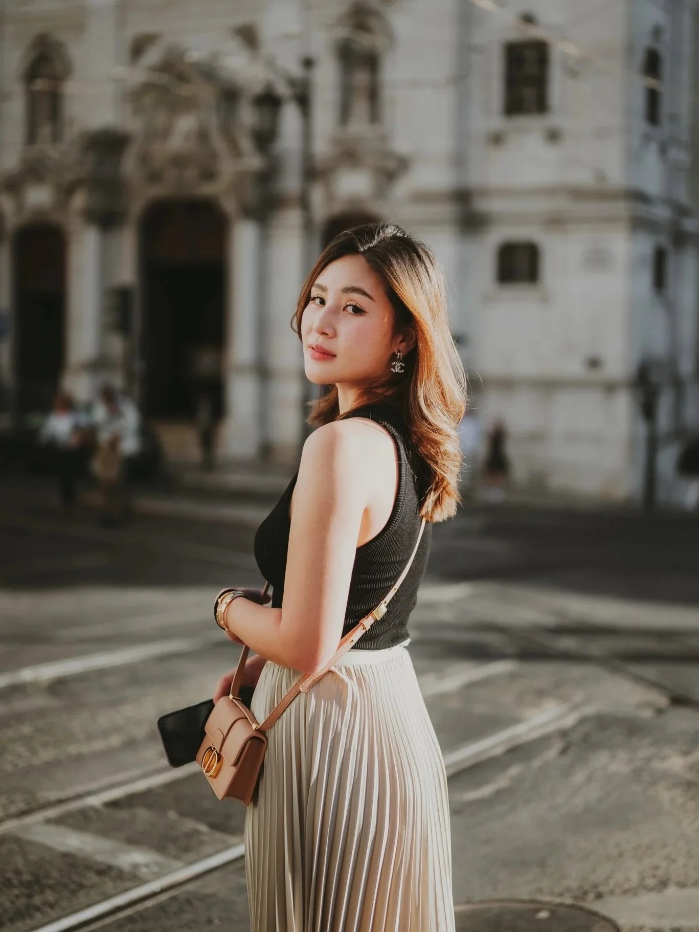 Candid, cinematic portrait of a woman in Lisbon at golden hour