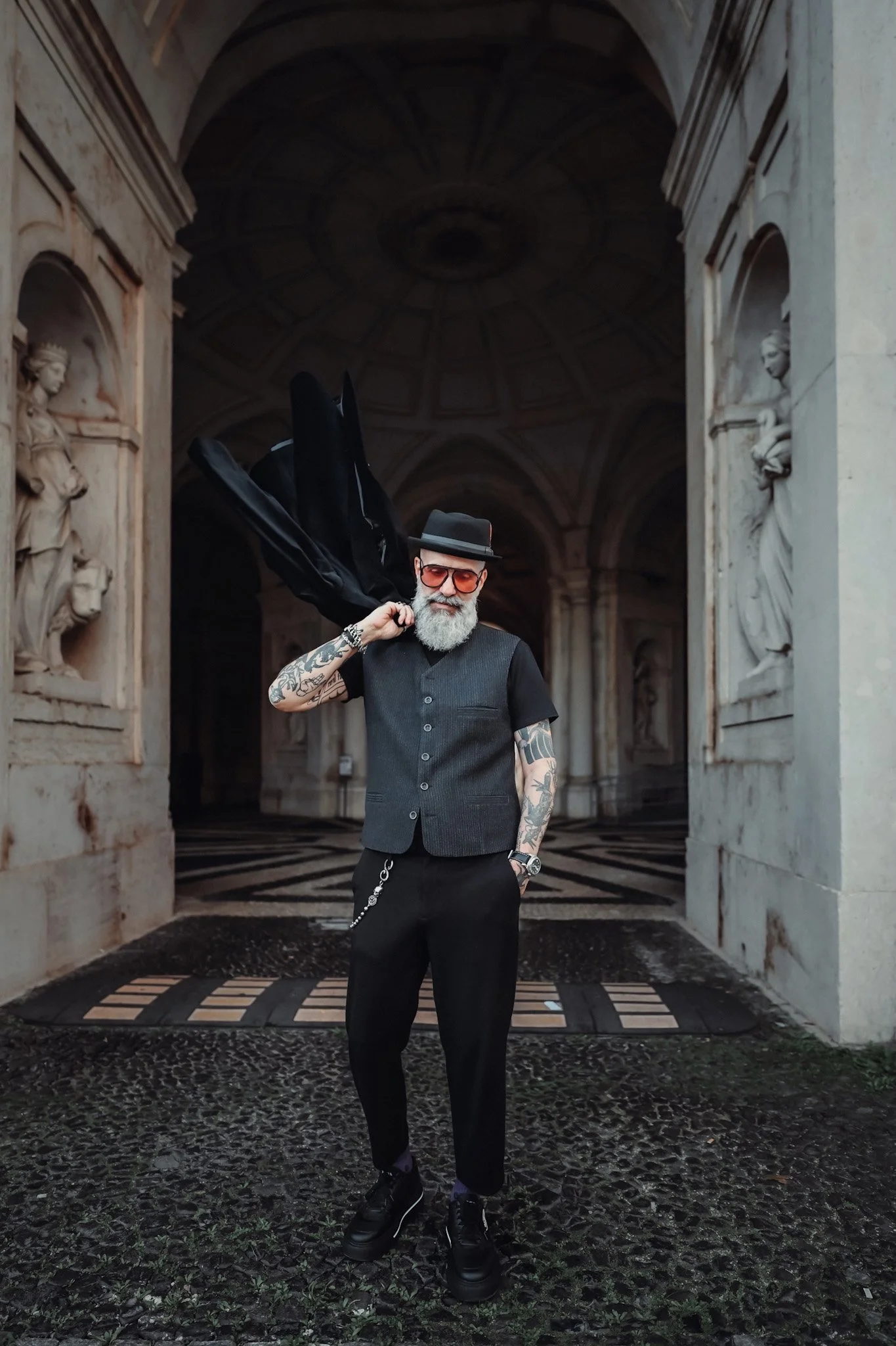 Cinematic portrait of a man in Lisbon, beautiful old architecture with statues in the background