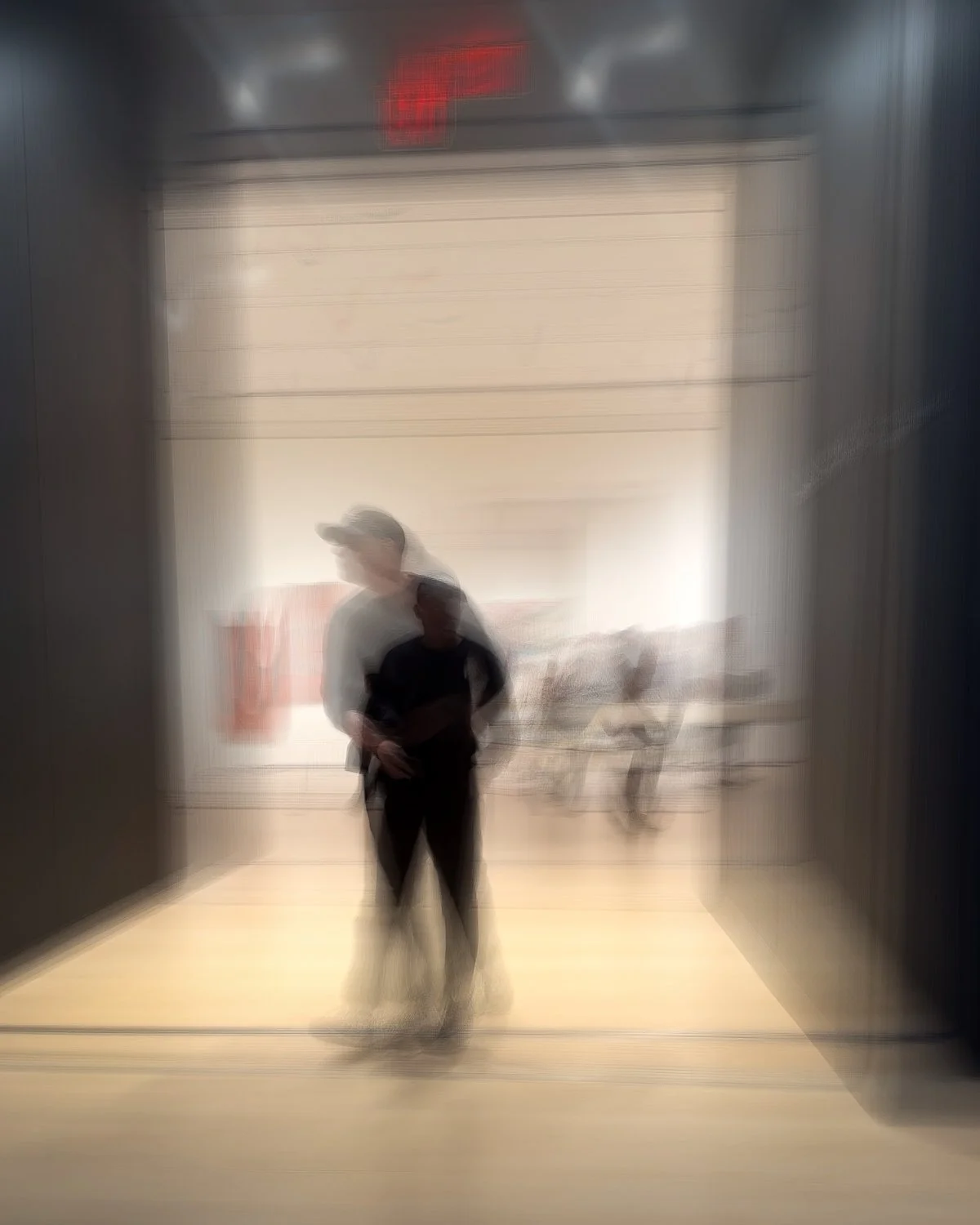 Abstract ICM Bluristic  photo - Blurred photo of two people walking through an elevator door