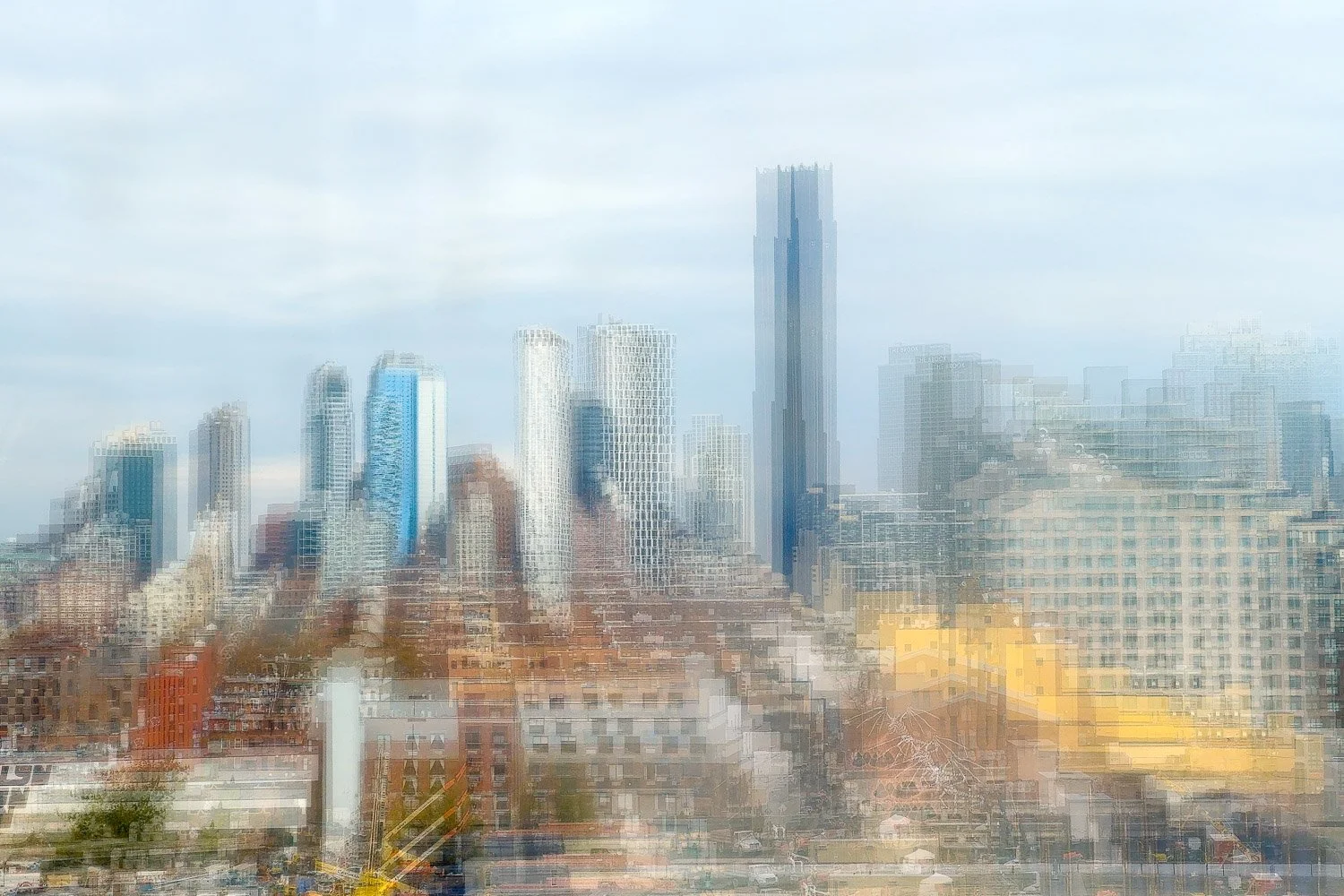 Abstract ICM Bluristic  photo - Blurred image of a city skyline with tall modern buildings under a cloudy sky.