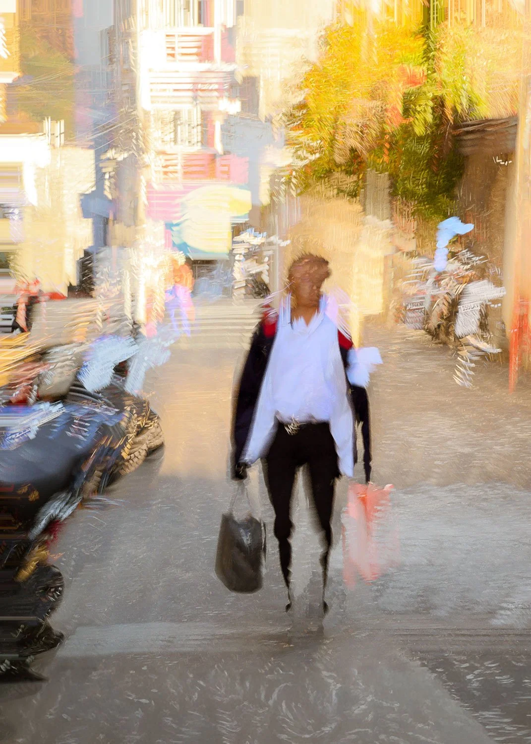 Abstract ICM Bluristic  photo - A blurred image of a person strolling a street in Guatemala