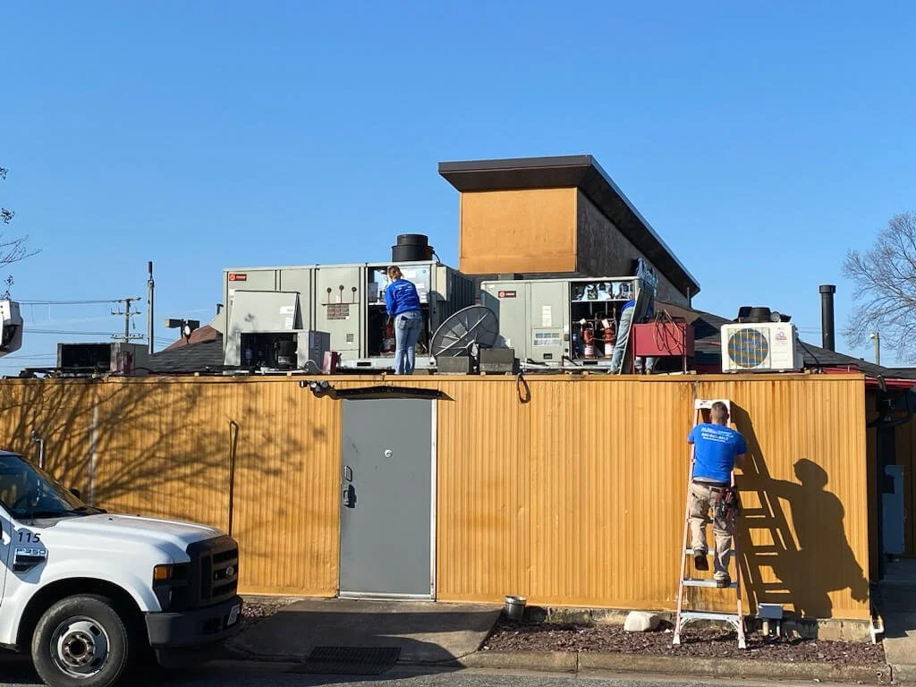 men working on HVAC
