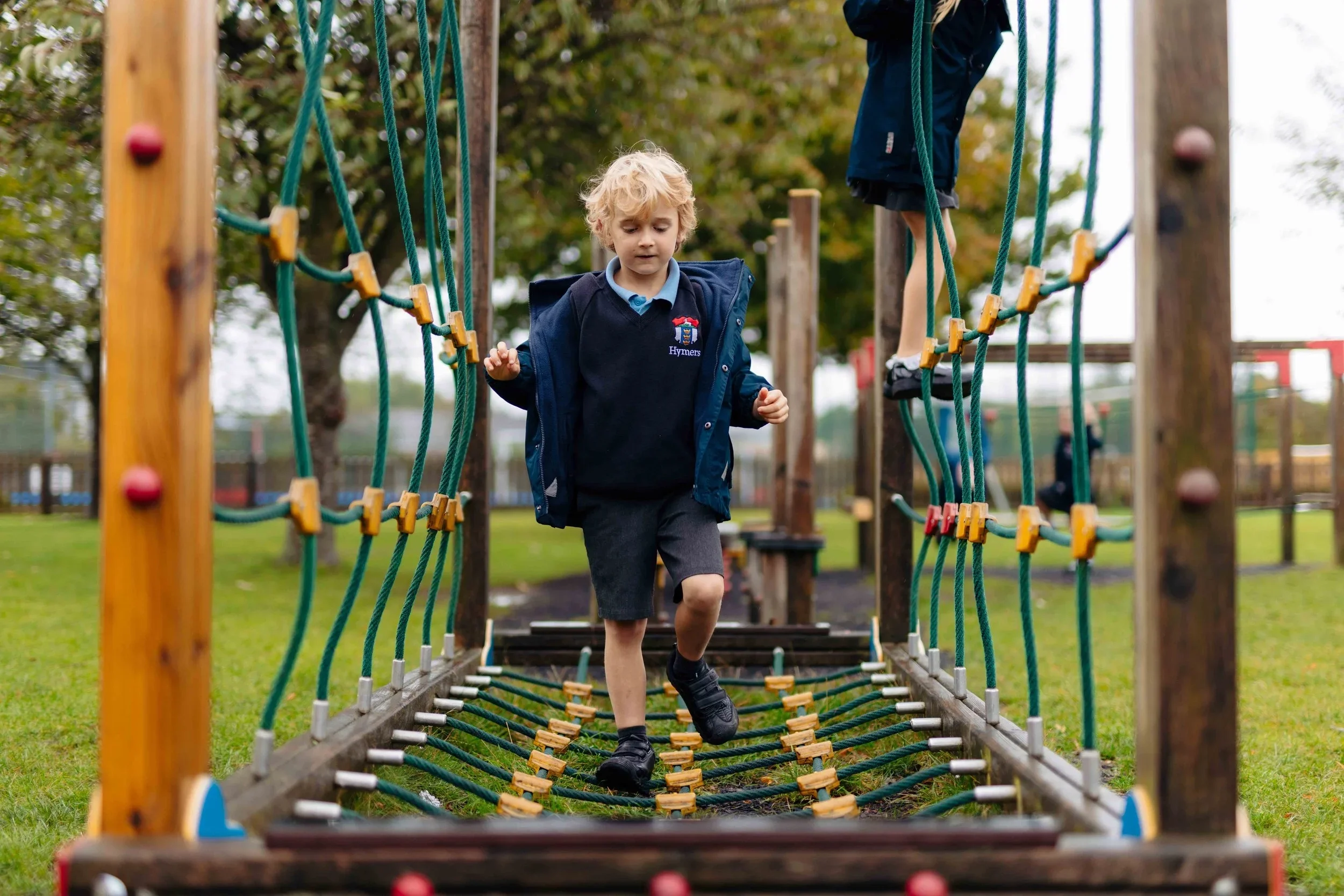 Hymers-Infant-School-pupil-playing-on-trim-trail.jpg.webp