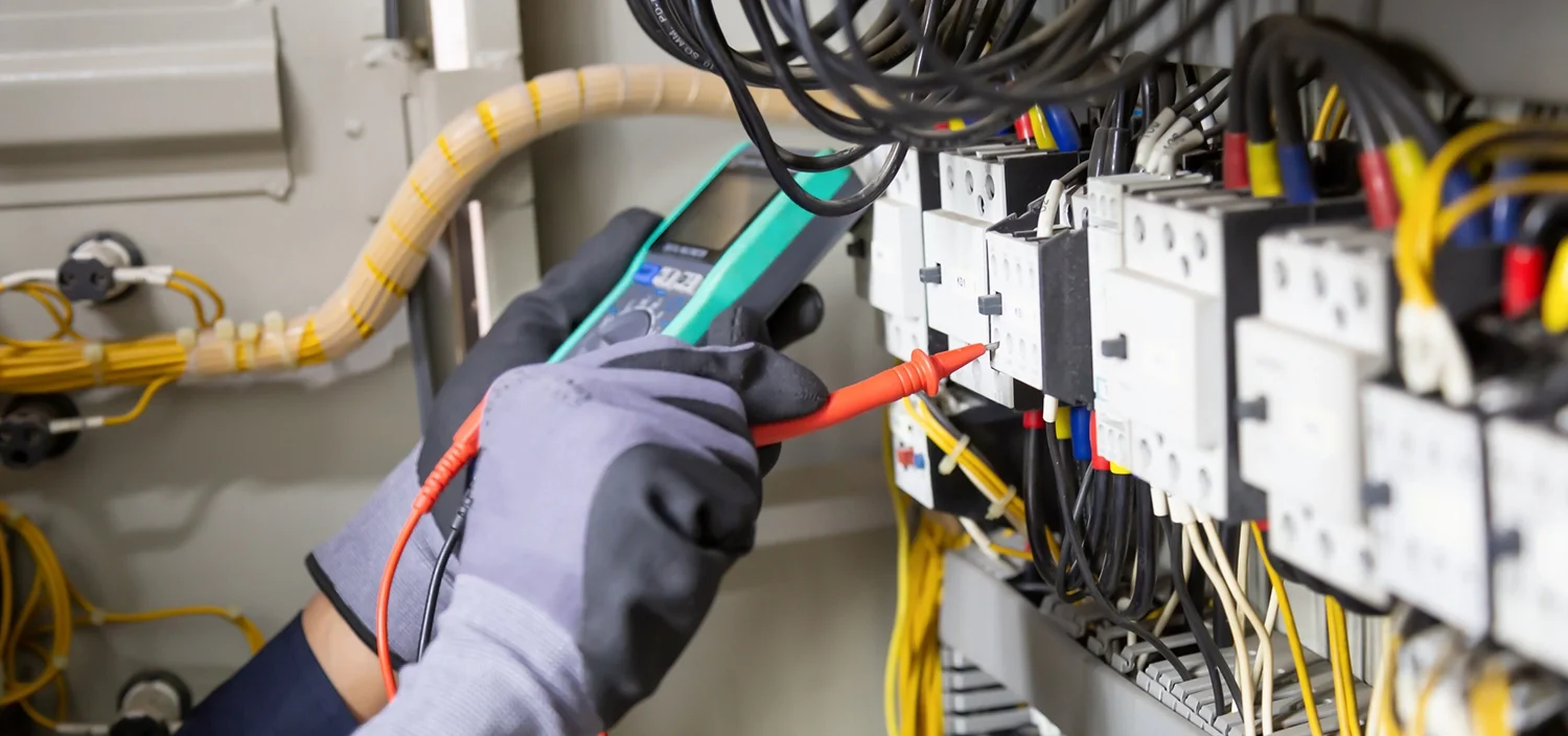 An aspiring electrician in New Jersey practicing hands-on panel wiring.