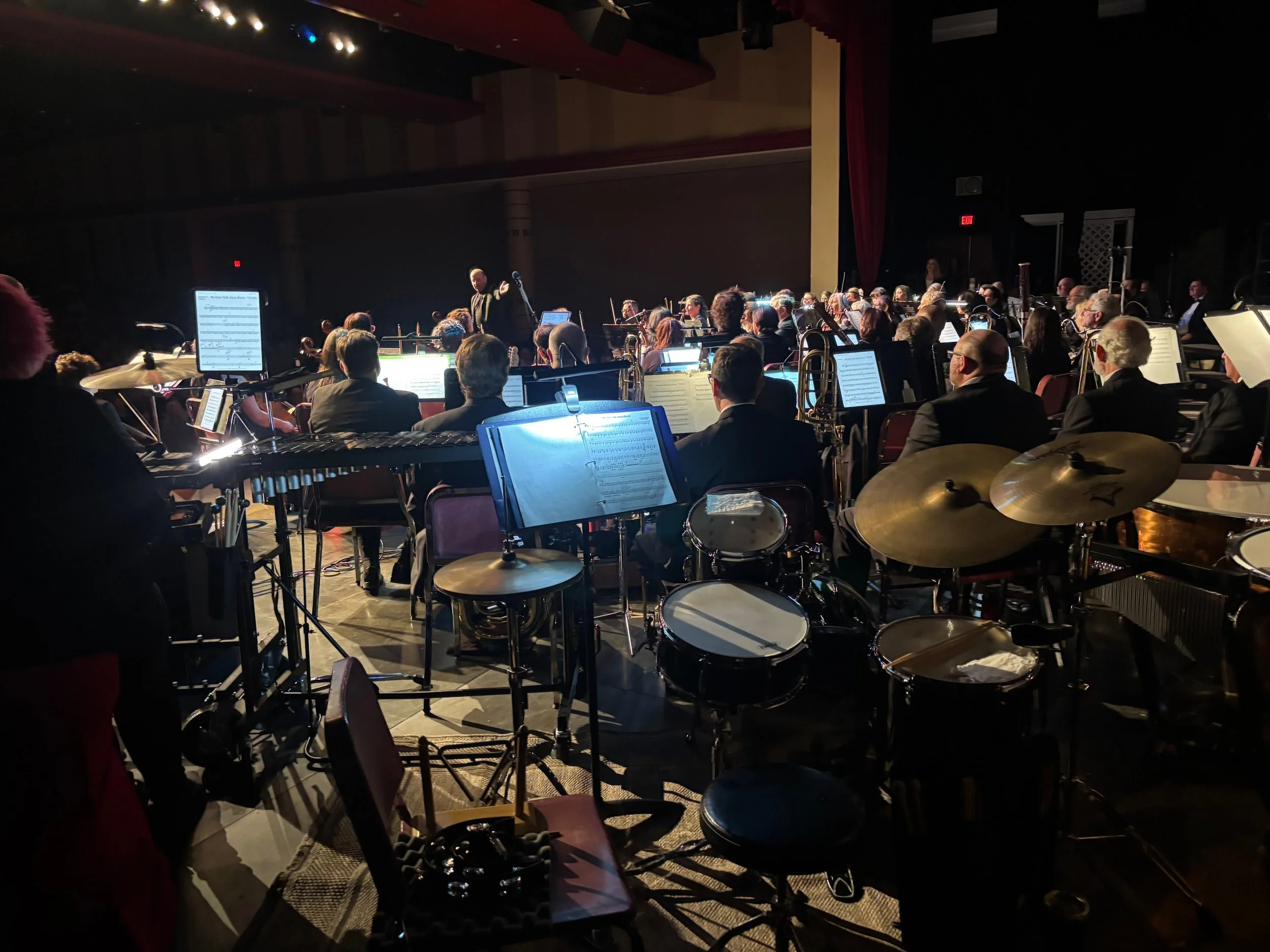 The South Jersey Pops in performance, led by Music Director and Conductor Robert Bradshaw. In addition to musically transforming this 77-piece orchestra, Bradshaw’s engaging commentary before each piece has become a highlight for the nearly 900 audie
