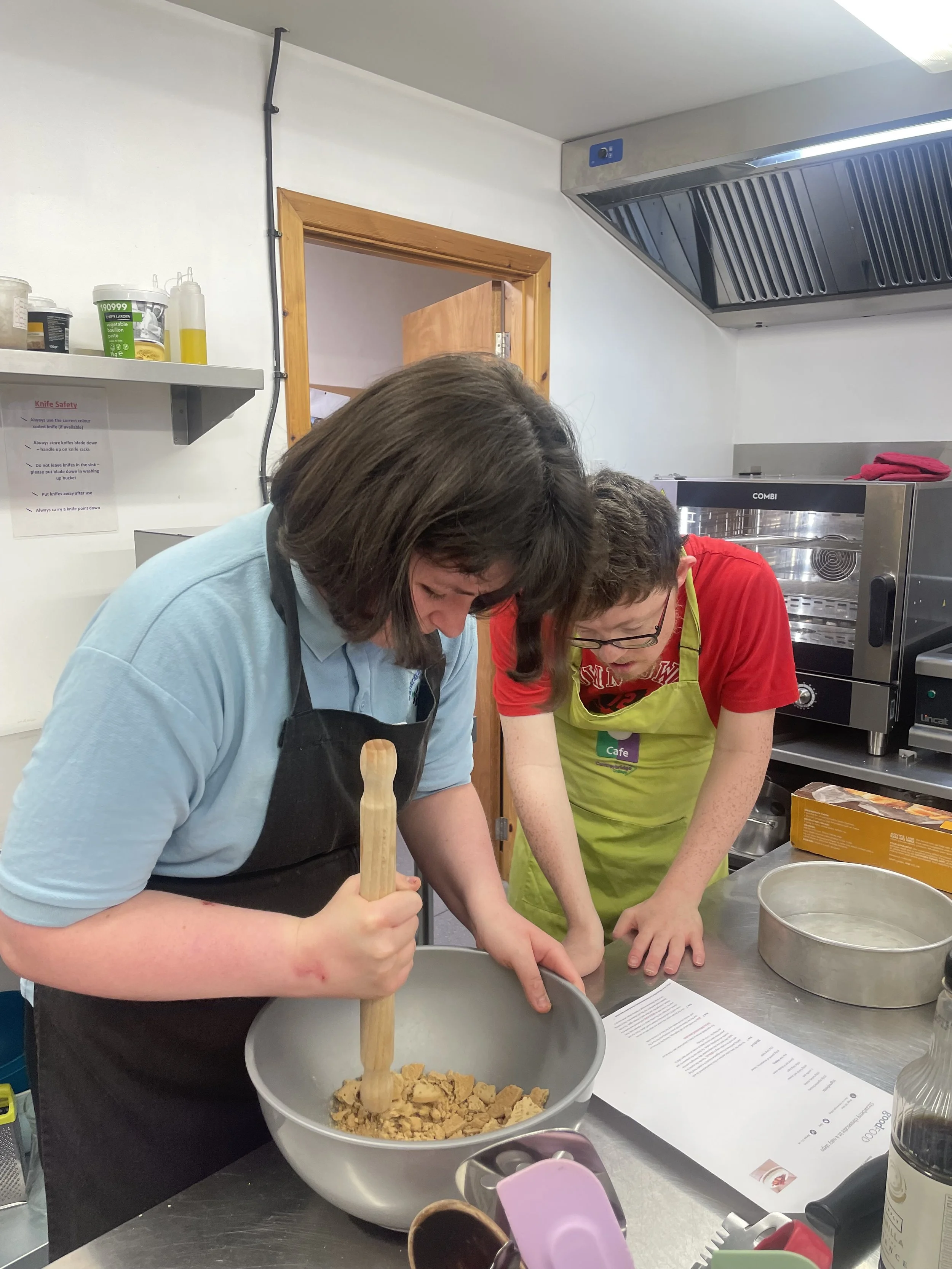 PHOTO FROM CHARITY: Students baking in cafe kitchen .jpeg