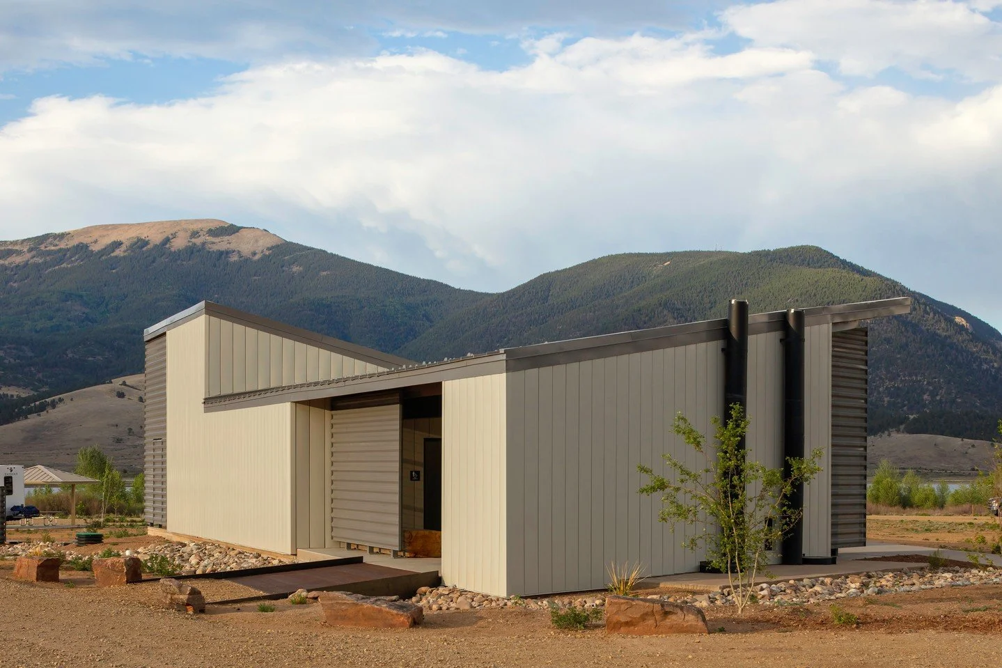 If you look closely there&rsquo;s an older layer to this new building. At Eagle Nest Lake State Park, the existing vault toilets were preserved rather than demolished, and the new comfort station was built directly over them.

The original black vent