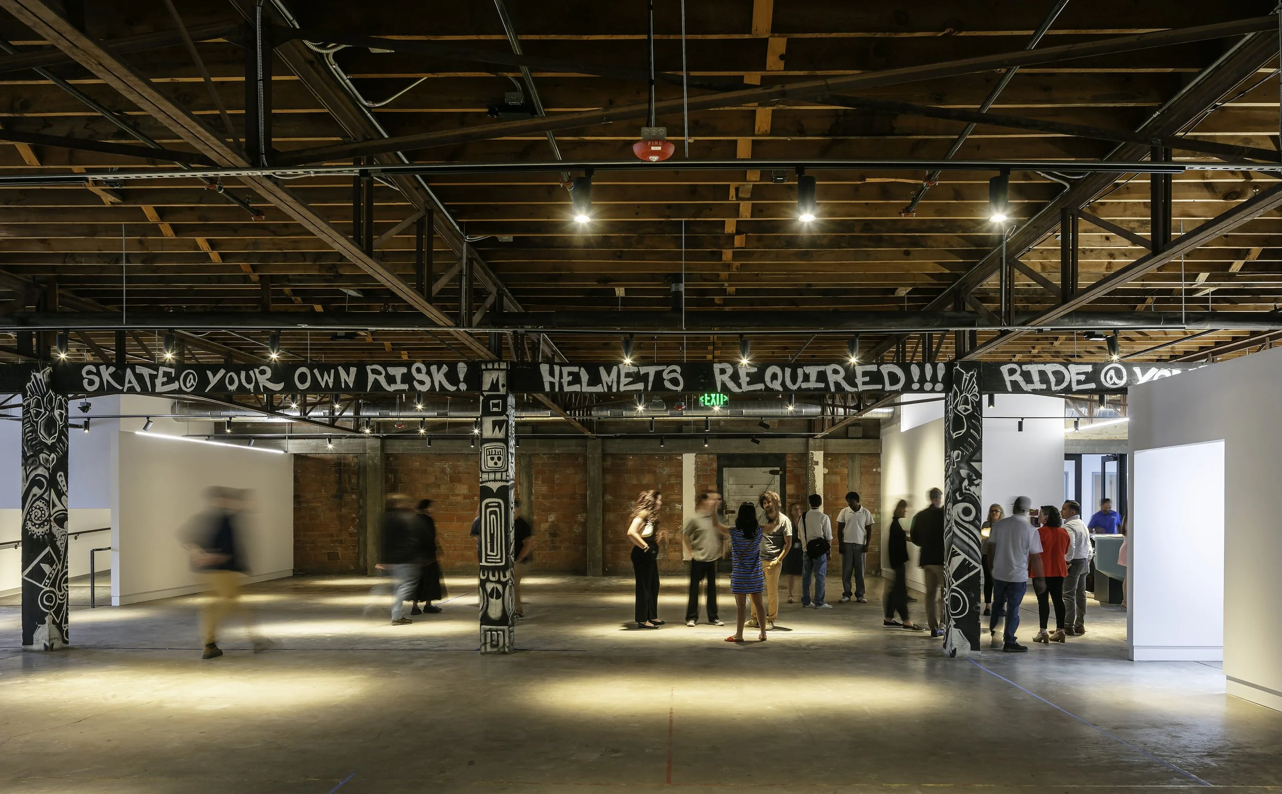 Renovated main gallery space with a crowd of visitors