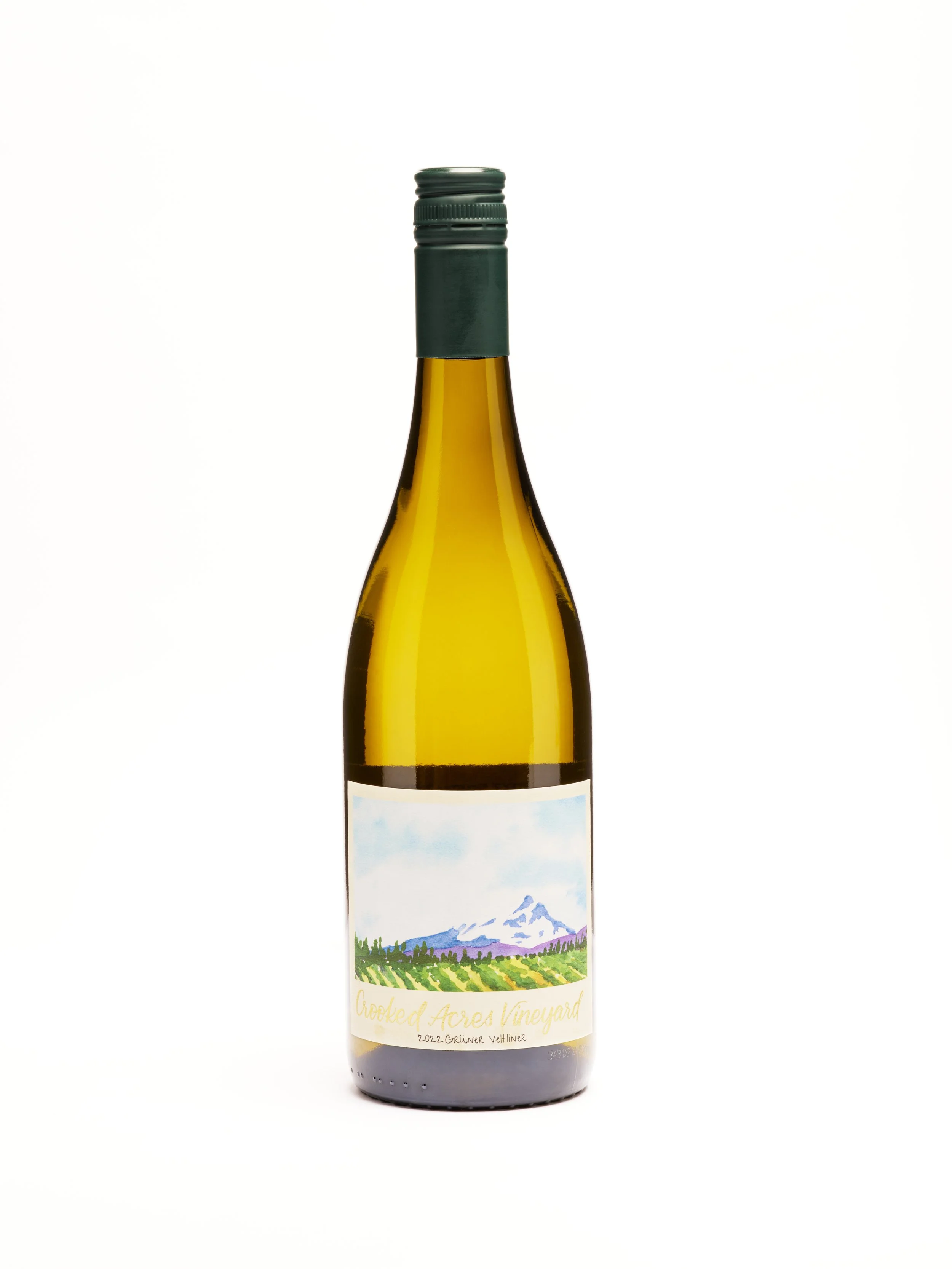 Wine bottle with label featuring landscape painting of mountains, greenery, and fields, with the text 'Crooked Acres Vineyard' and '2022 Grüner Veltliner'.