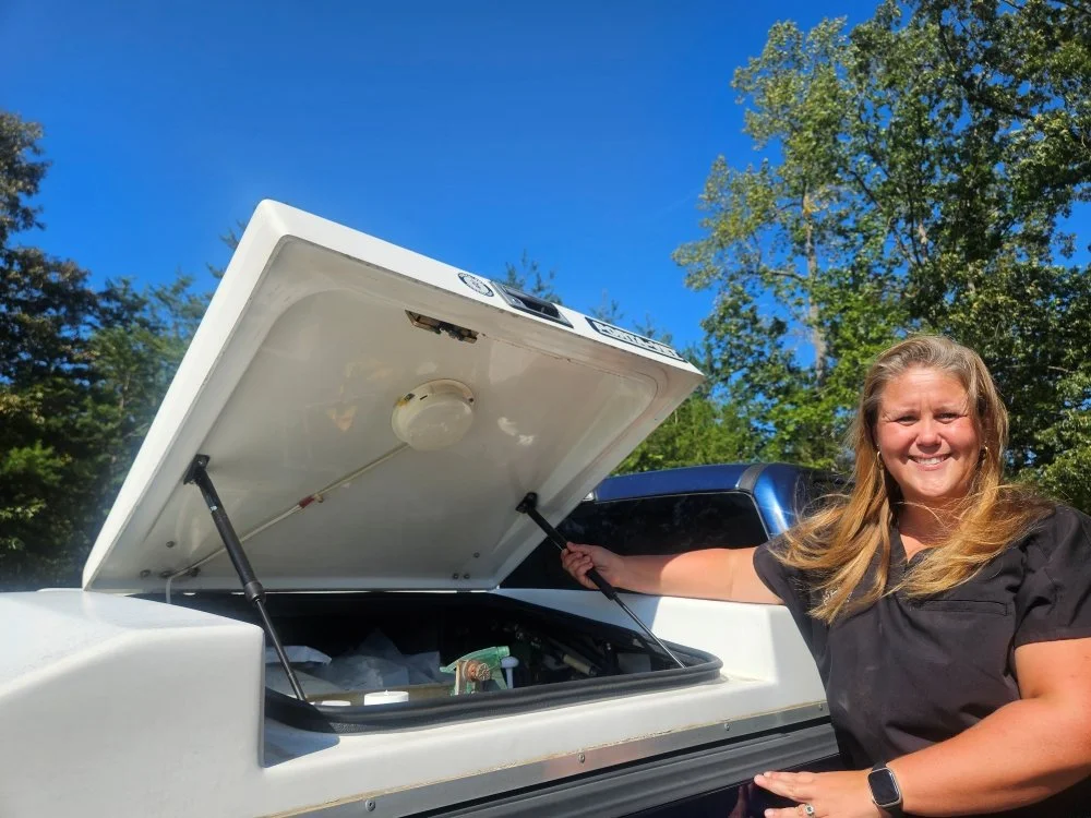 Dr. Mallan Willis stand with new truck