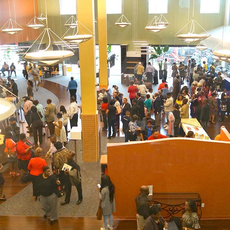 event attendees walking inside The KBC Houston