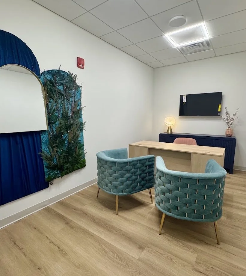 Commercial Interior Design: Owner’s office at a wellness center in Spring House, PA, with personalized details like brass finishes, deep blue tones, and a velvety, forest-inspired feel.