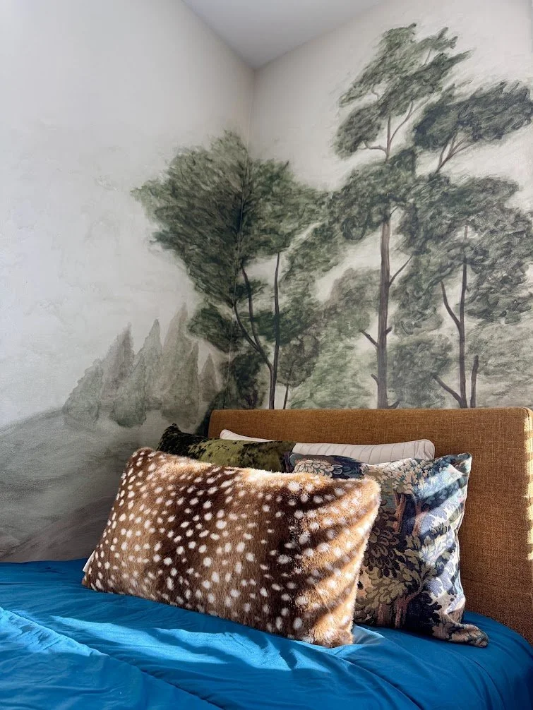 Hand-painted forest mural detail, custom artwork created exclusively for this space.