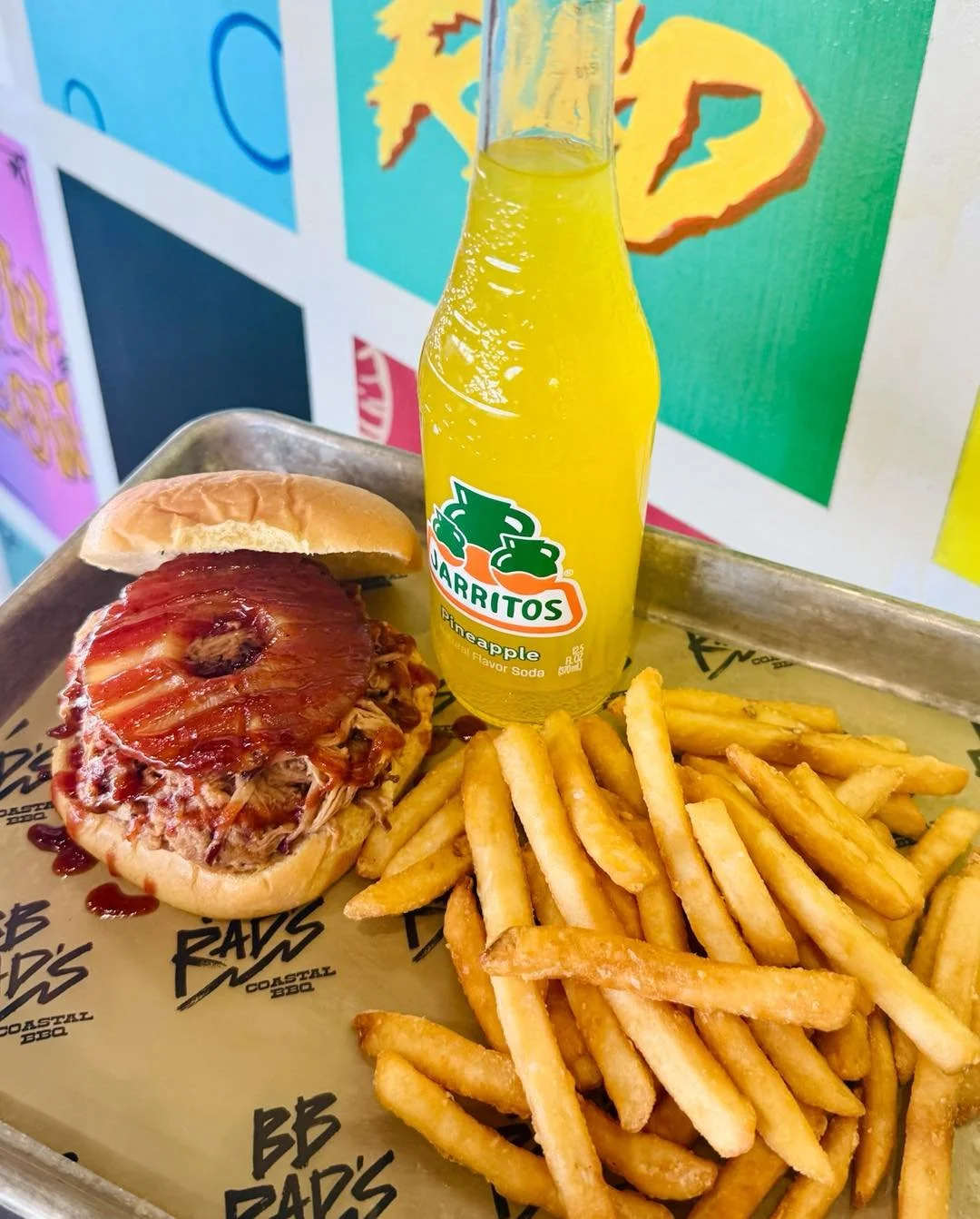 Spring Break just got a whole lot sweeter 🌴🔥🤙

Introducing the Paradise Pig! A pulled pork sandwich topped with a candied pineapple ring and our signature sauce. Sweet, smoky, and straight-up coastal. 🍍

Comes with one side and a drink for $9.99 