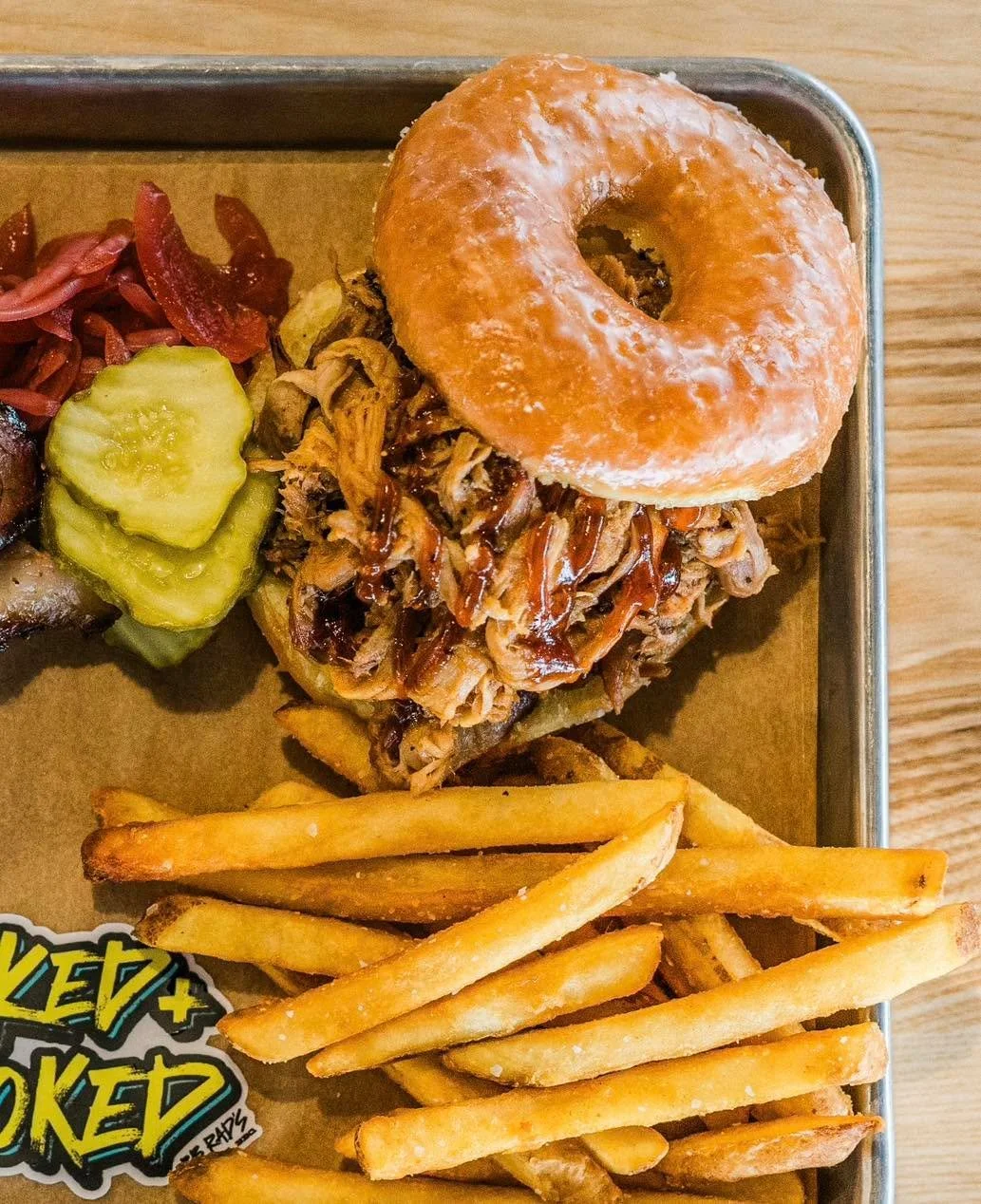 The Officer is back on patrol. 🚨🚔🍩

Slow-smoked pulled pork stacked between a fresh glazed donut from Kim&rsquo;s. If you know, you know 🤙

Available Fridays only.