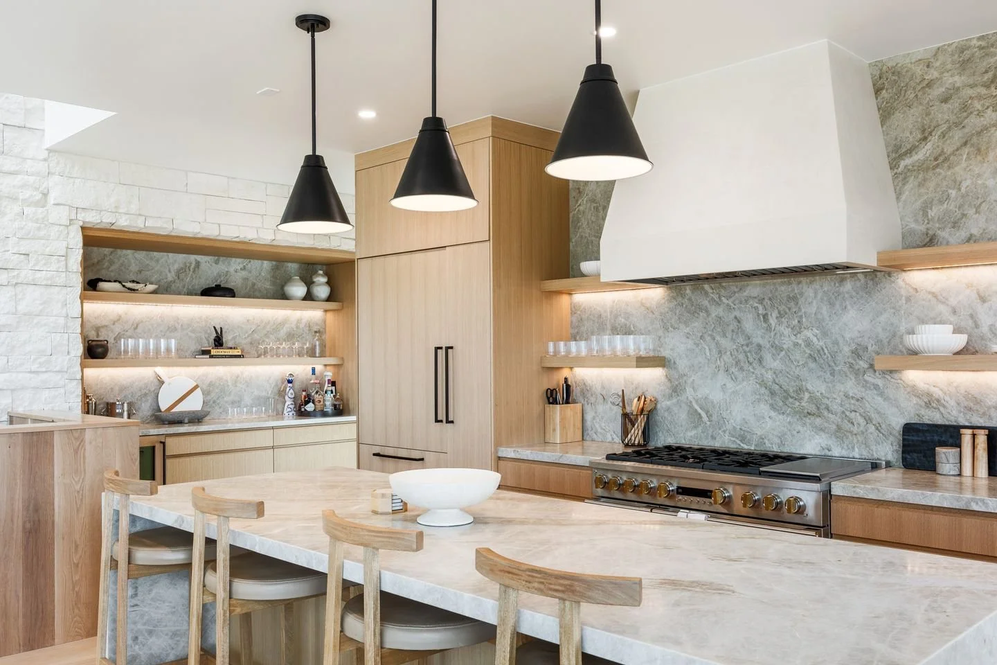 The kitchen in the Islay Way House was designed to work smarter and look cleaner. 

By removing the sink from the island, the space becomes a streamlined, uninterrupted workspace that is perfect for gathering, serving, and everyday living. A fully eq