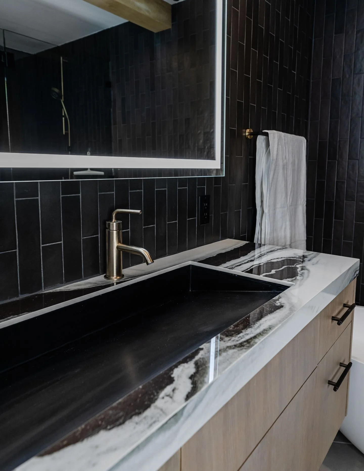 Texture is what quietly decides whether a space feels calm or sharp, warm or clinical, grounded or cold. 

The mix is everything; stack the wrong combination and even a beautiful room feels slightly off, and you can't say why.

The bathrooms in this 
