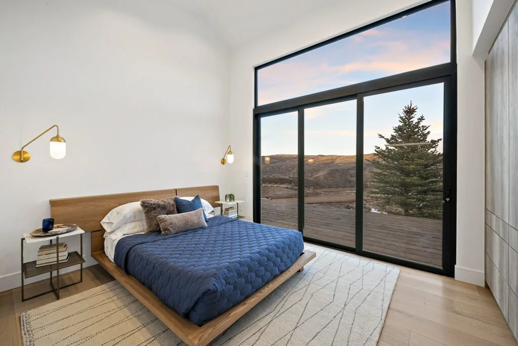 Icon-House-Benloch-Heber-City-Bedroom-Hillside-View-Platform-Bed-Brass-Wall-Sconces-Roderick-Builders-Modern-Custom.jpg