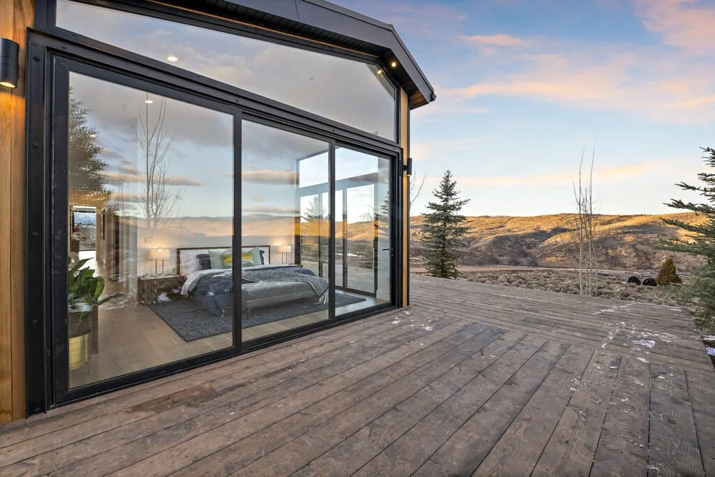 Icon-House-Benloch-Heber-City-Exterior-Deck-Master-Bedroom-Glass-Wall-Hillside-View-Roderick-Builders-Modern-Custom.jpg