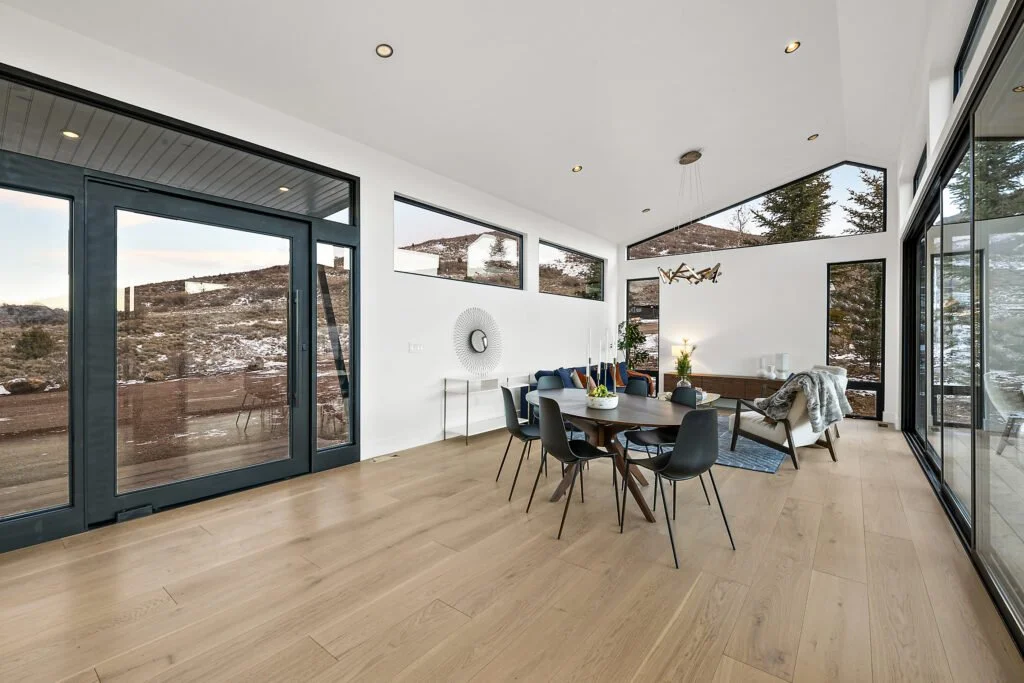 Icon-House-Benloch-Heber-City-Dining-Living-Wide-Plank-Floor-Vaulted-Ceiling-Black-Frame-Doors-Roderick-Builders-Modern-Custom.jpg