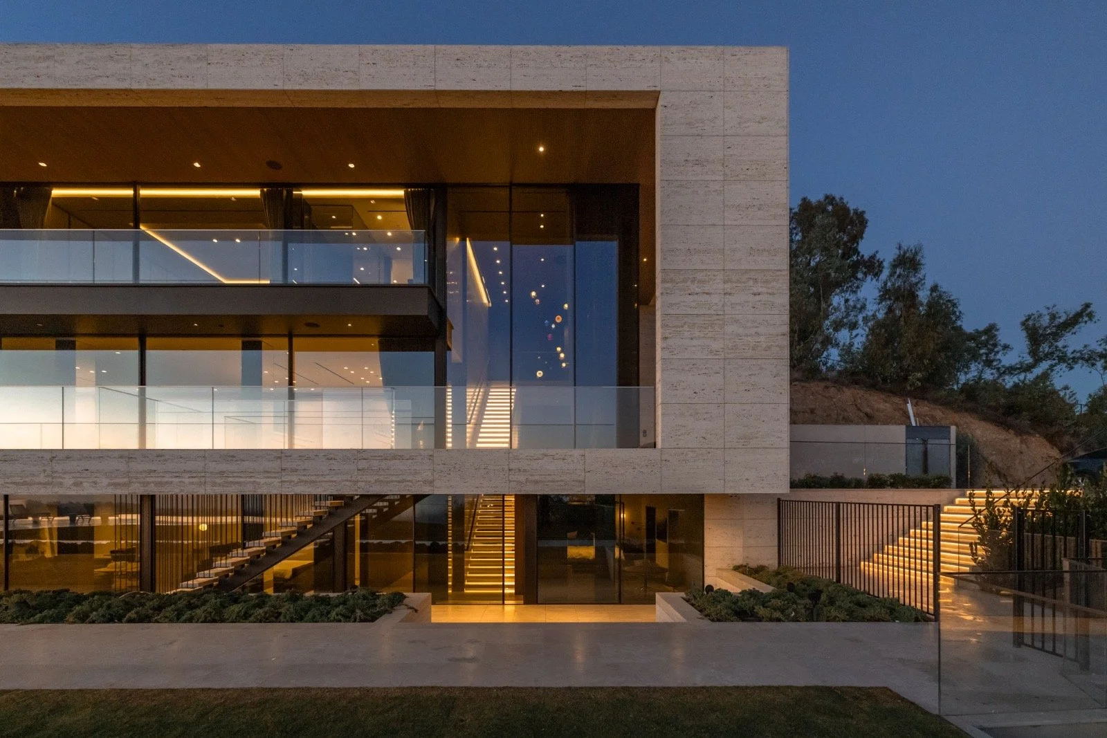 684-Firth-Brentwood-CA-LA-Exterior-Travertine-Facade-Night-Illumination-Floating-Stairs-Glass-Railing-Roderick-Builders-Modern-Home.JPG