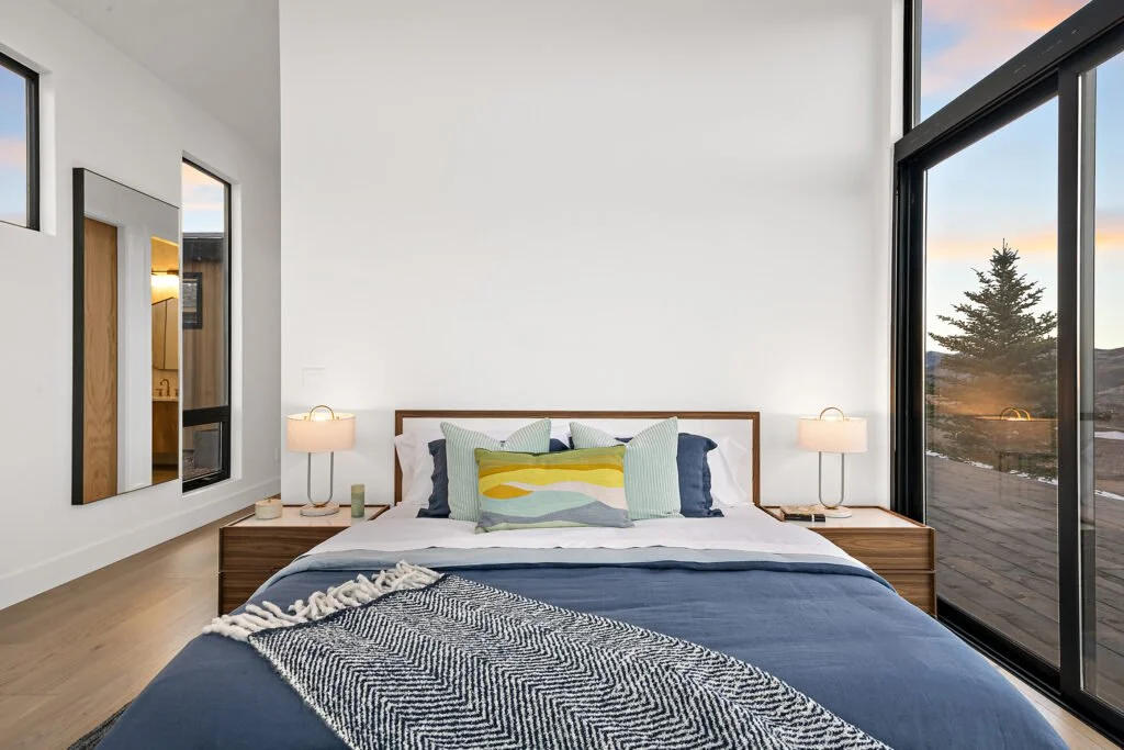 Icon-House-Benloch-Heber-City-Bedroom-Wood-Headboard-Sliding-Glass-Door-Bedside-Lamps-Mountain-View-Roderick-Builders-Modern-Custom.jpg