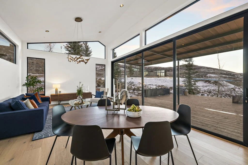 Icon-House-Benloch-Heber-City-Dining-Room-Oval-Table-Vaulted-Ceiling-Large-Sliding-Doors-Roderick-Builders-Modern-Custom.jpg