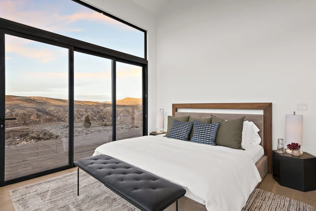 Icon-House-Benloch-Heber-City-Bedroom-Sliding-Glass-Door-Hillside-View-Wood-Headboard-Leather-Bench-Roderick-Builders-Modern-Custom.jpg