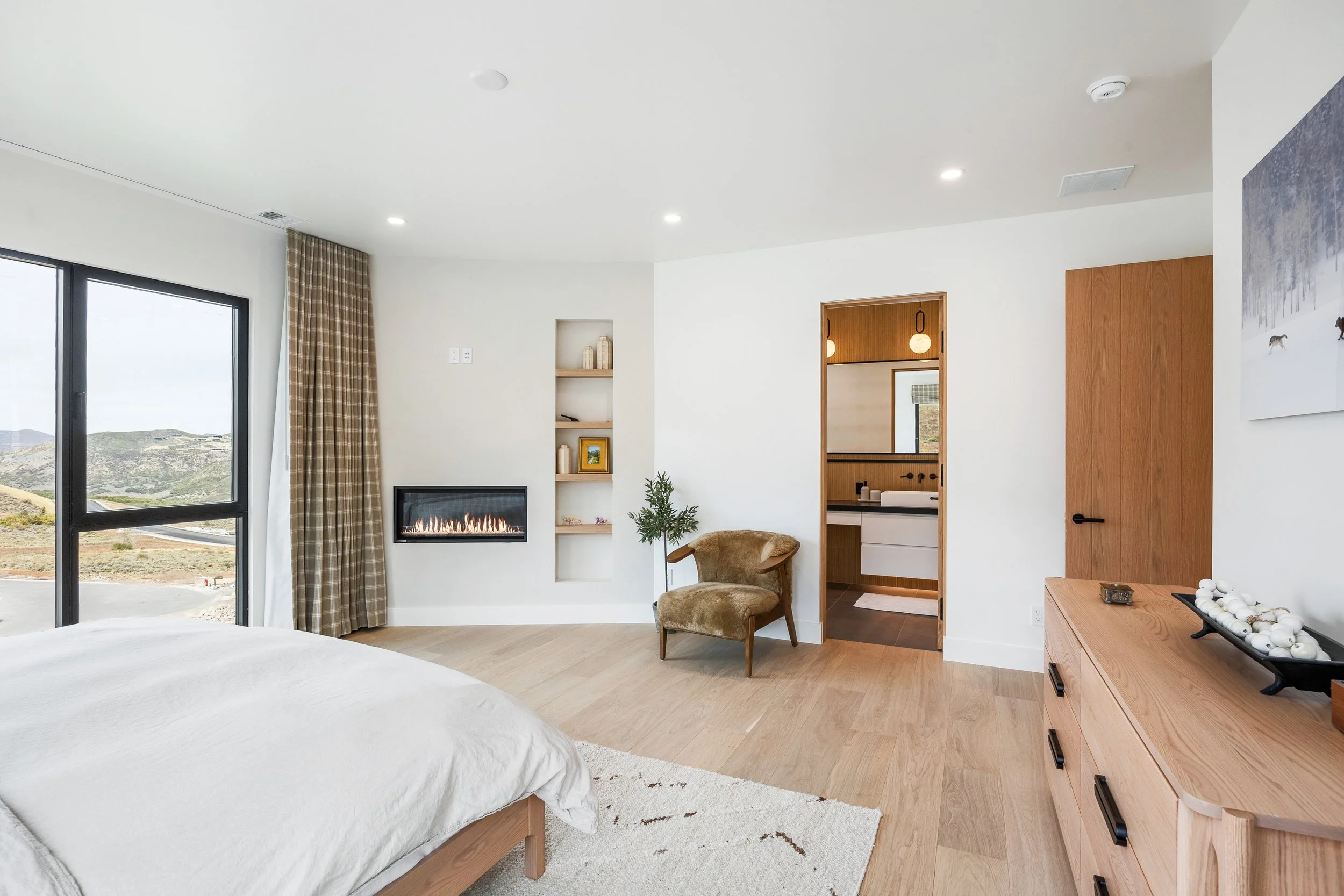 Benloch-134-Heber-City-Master-Bedroom-Oak-Console-Desk-Shelves-Scandinavian-Fireplace-Roderick-Builders-Mountain-Modern.jpg