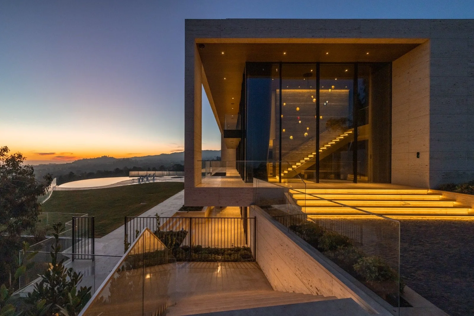 684-Firth-Brentwood-CA-LA-Exterior-Sunset-Facade-Travertine-Illuminated-Entry-Stairs-Roderick-Builders-Modern-Home.JPG
