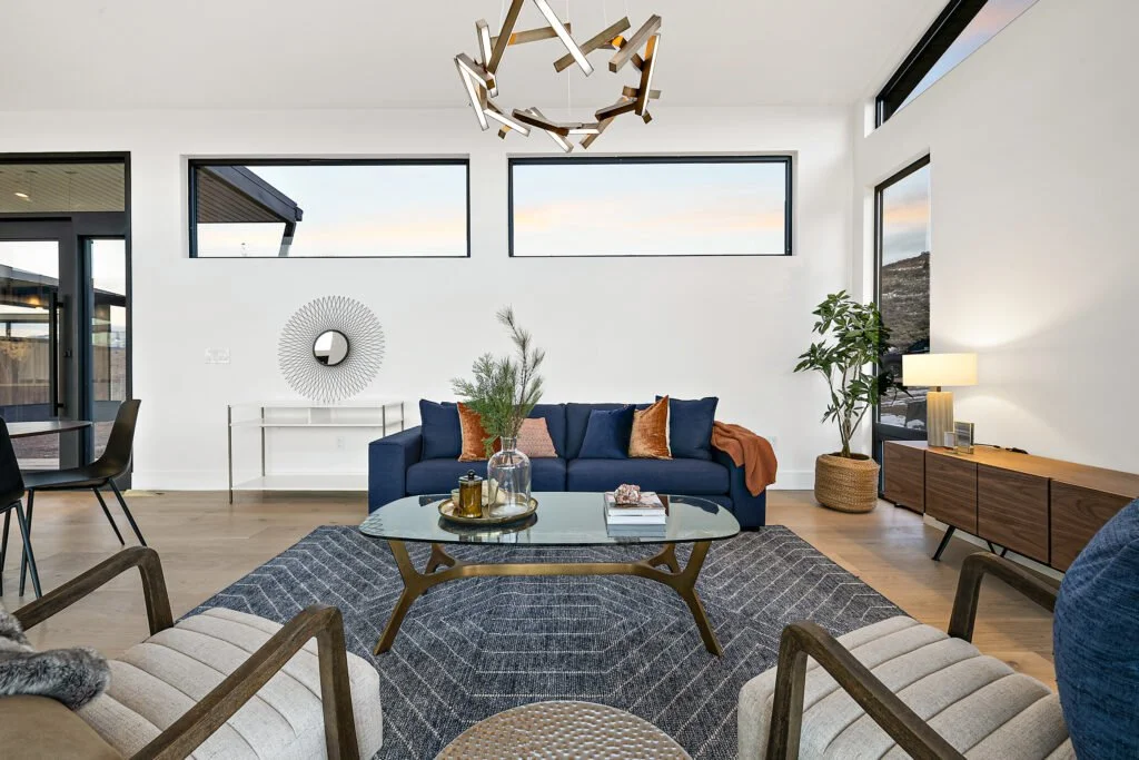 Icon-House-Benloch-Heber-City-Living-Room-Navy-Sofa-Abstract-Chandelier-Mid-Century-Credenza-Roderick-Builders-Modern-Custom.jpg