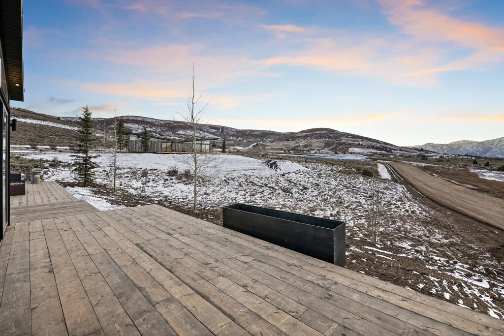 Icon-House-Benloch-Heber-City-Exterior-Wood-Deck-Snowy-Mountain-View-Black-Planter-Roderick-Builders-Modern-Custom.jpg
