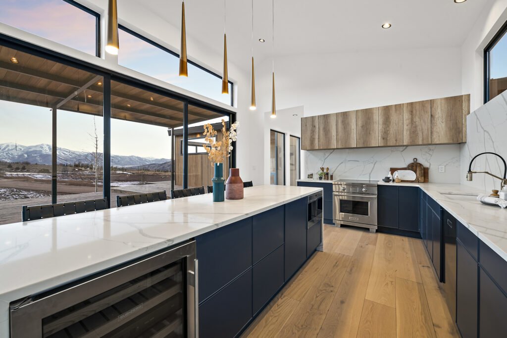 Icon-House-Benloch-Heber-City-Kitchen-Blue-Island-Mountain-View-Wine-Fridge-Brass-Pendants-Roderick-Builders-Modern-Custom.jpg