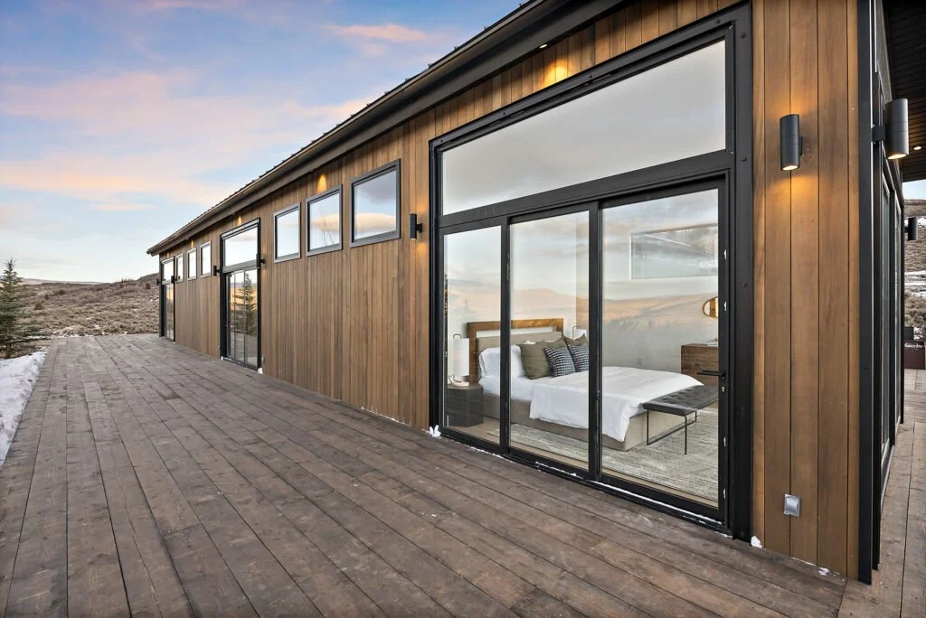 Icon-House-Benloch-Heber-City-Exterior-Deck-Master-Bedroom-Glass-Sliding-Doors-Wood-Siding-Roderick-Builders-Modern-Custom.jpg