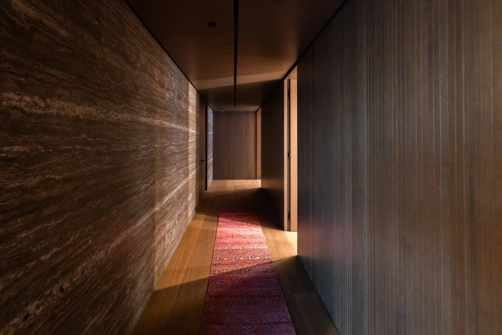 684Firth-Brentwood-CA-LA-Interior-Hallway-Stone-Accent-Wall-Wood-Paneling-Linear-Lighting-Roderick-Builders-Modern-Home.JPG