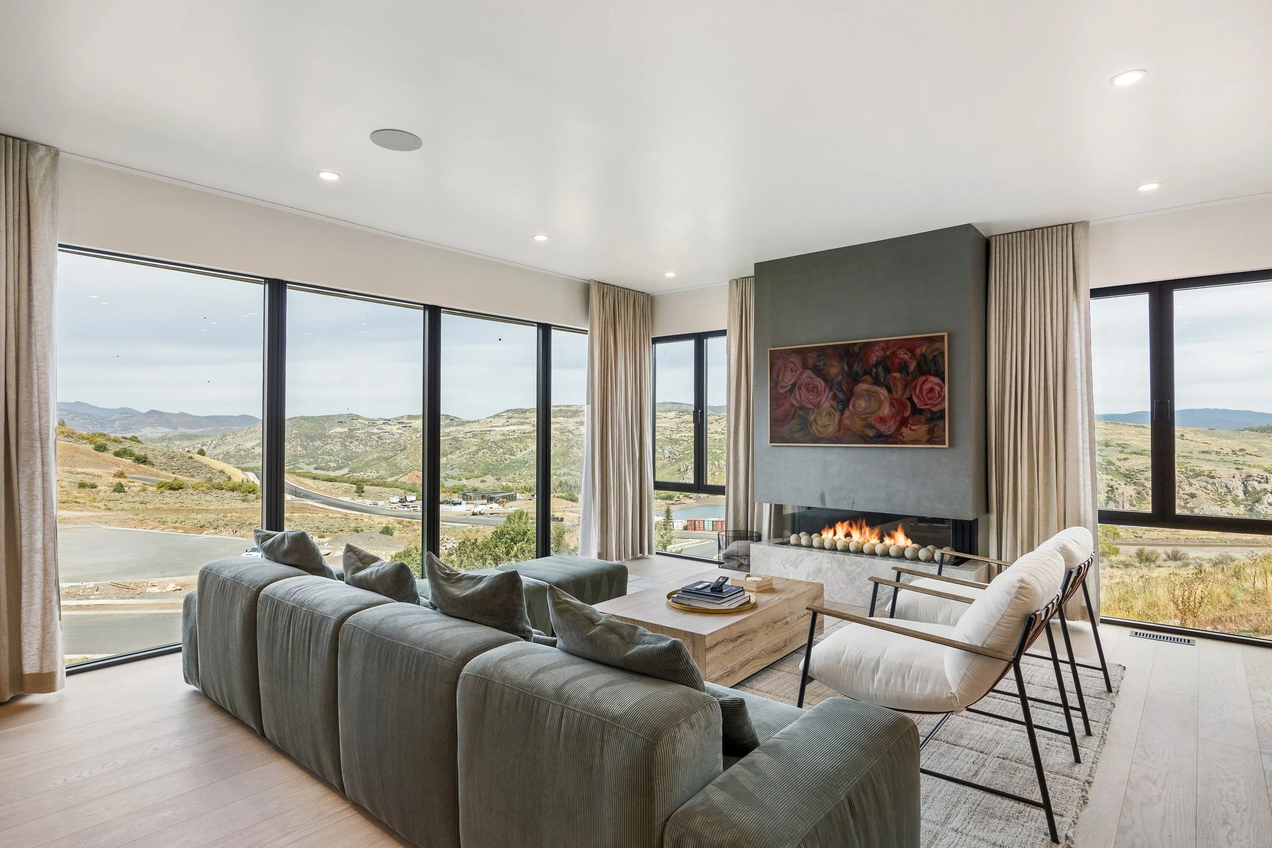 Benloch-134-Heber-City-Living-Room-Floor-to-Ceiling-Windows-Panoramic-Mountain-View-Concrete-Fireplace-Roderick-Builders-Mountain-Modern.jpg