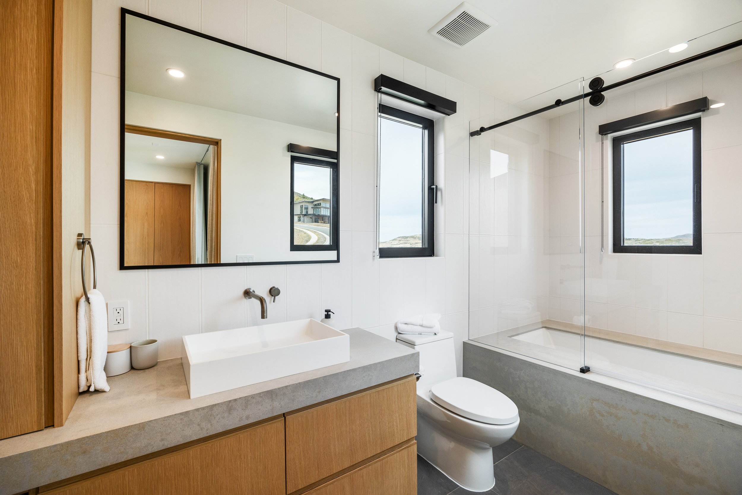 Benloch-134-Heber-City-Toilet-and-Bath-Shower-Glass-Taj-Mahal-Bath-Tub-Cabinet-Oak-Roderick-Builders-Mountain-Modern.jpg